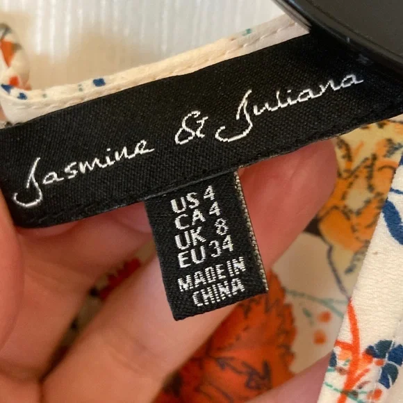 Jasmine & Juliana Floral Sleeveless Romper in Cream Orange Blooms - Picture 2 of 11